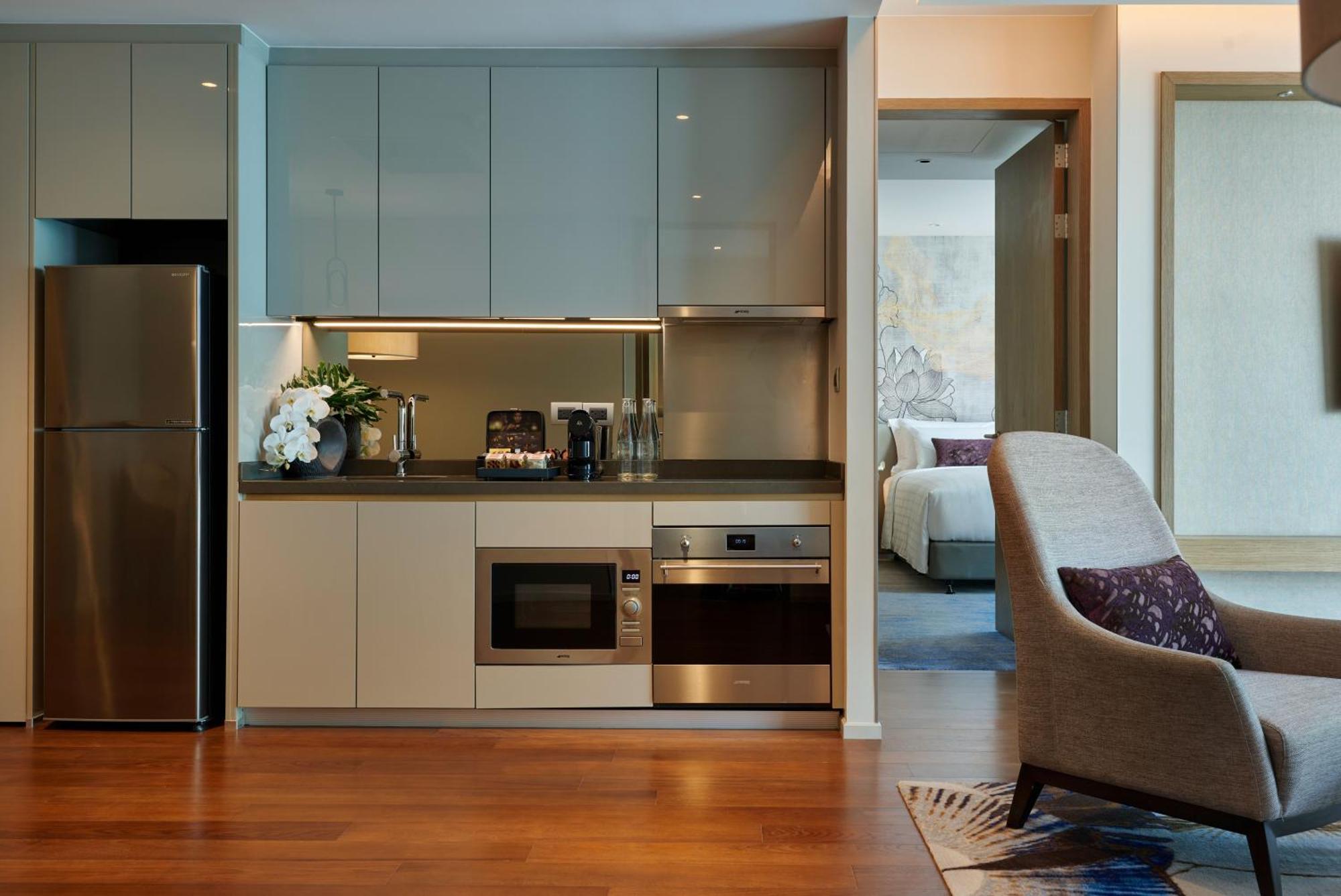 Chatrium Grand Bangkok Exterior photo A kitchen in a serviced apartment